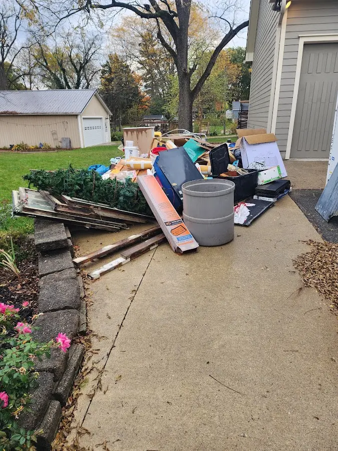 Dumpster being loaded with debris for 3 Yard Dumpster Rental in West Goshen